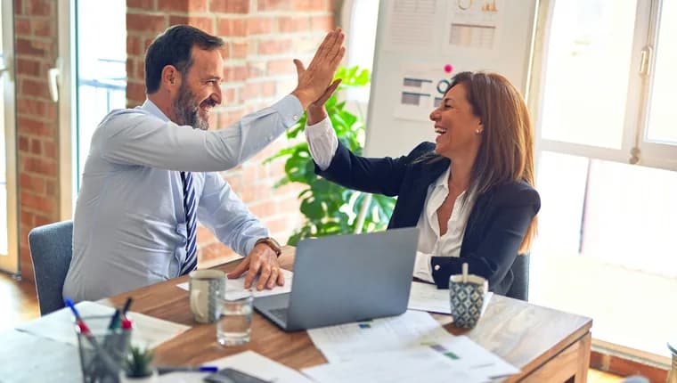 Professionals celebrating exam success